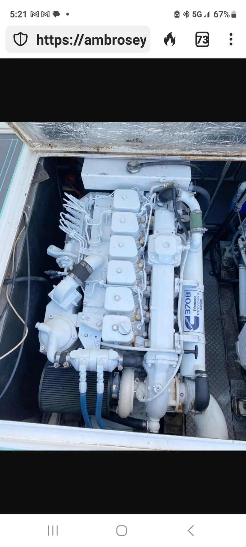 Slide: The Image of Engine compartment of a 2000 Dawson Yachts 33 EXPRESS, showcasing a well-maintained marine engine. - 27