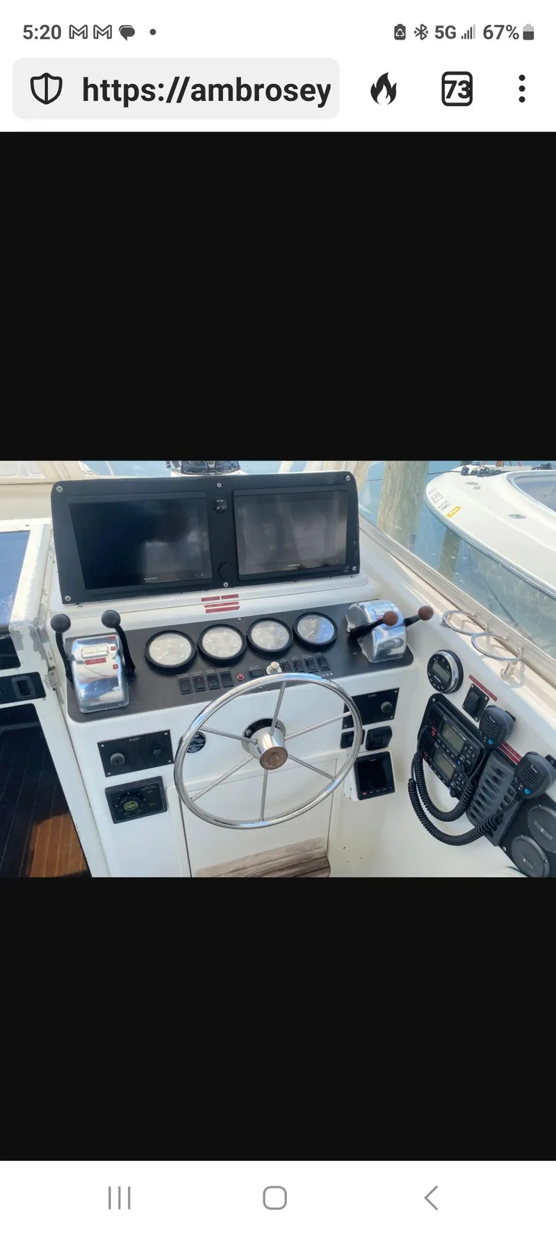Slide: The Image of Helm of 2000 Dawson Yachts 33 EXPRESS with steering wheel and navigation instruments. - 4