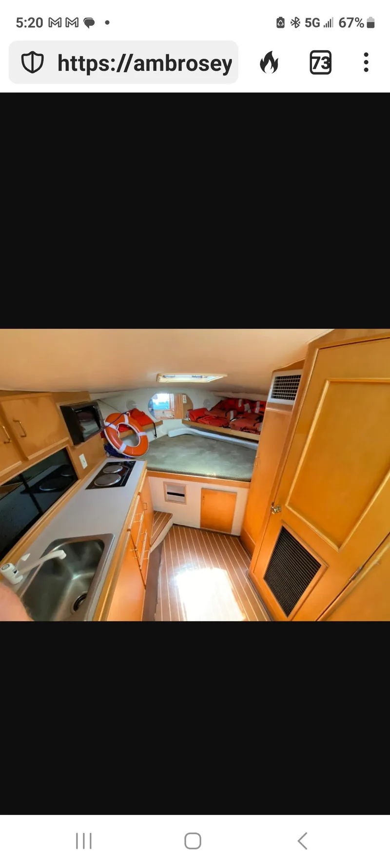 Slide: The Image of Interior of 2000 Dawson Yachts 33 EXPRESS, featuring kitchen and cozy cabin space. - 9