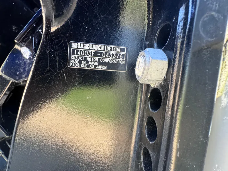 Slide: The Image of Clearwater 2000 C/C boat at dealership, 2021 model, with sale banners in background. - 18