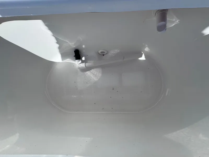 Slide: The Image of 2021 Clearwater 2000 C/C boat interior with white seating and console. - 31