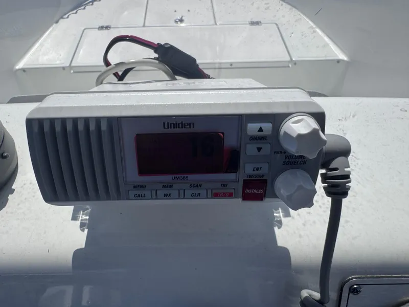 Slide: The Image of Open storage compartment in 2021 Clearwater 2000 C/C boat, featuring electrical components. - 38