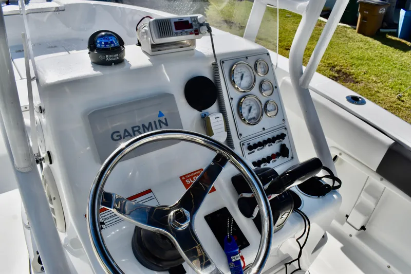 Slide: The Image of Interior view of a 2021 Clearwater 2000 C/C boat compartment with wiring and components. - 44