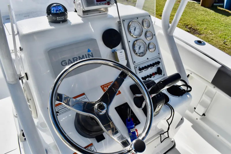 Slide: The Image of Open storage compartment on 2021 Clearwater 2000 C/C boat with coiled rope inside. - 48