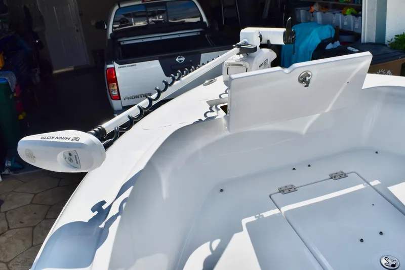 Slide: The Image of Clearwater 2000 C/C boat deck, 2021 model, featuring a clean, white surface with storage hatch. - 52