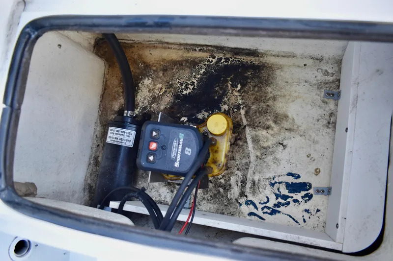 Slide: The Image of Open hatch on 2021 Clearwater 2000 C/C boat deck, showing storage compartment. - 56