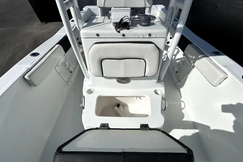Slide: The Image of Clearwater 2000 C/C 2021 boat seat with white cushions and black trim. - 61