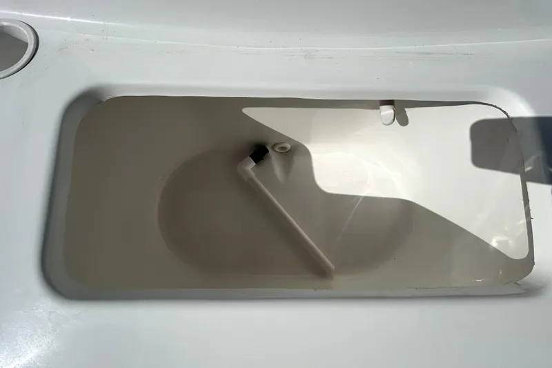 Slide: The Image of Clearwater 2000 C/C 2021 boat interior with seating and storage compartments. - 62