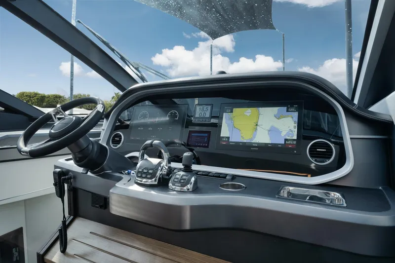Slide: The Image of Cockpit of 2022 Pearl 62 yacht with advanced navigation system and controls. - 11