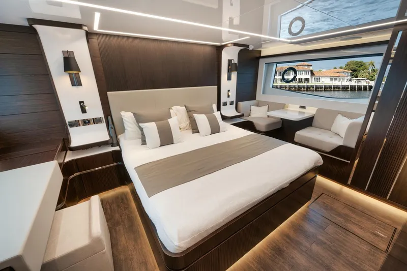 Slide: The Image of Luxurious bedroom interior on 2022 Pearl 62 yacht with modern design and large window view. - 13