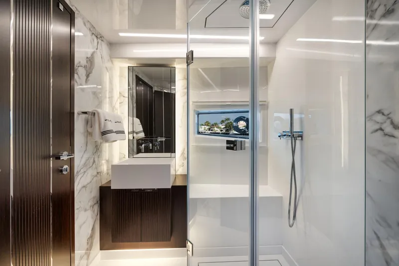 Slide: The Image of Luxurious bathroom in 2022 Pearl 62 yacht with marble walls and modern fixtures. - 18
