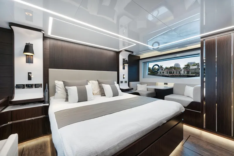 Slide: The Image of Luxurious bedroom interior on 2022 Pearl 62 yacht with modern design and large window view. - 22