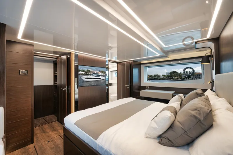 Slide: The Image of Luxurious bedroom interior of 2022 Pearl 62 yacht with modern design and scenic window view. - 24
