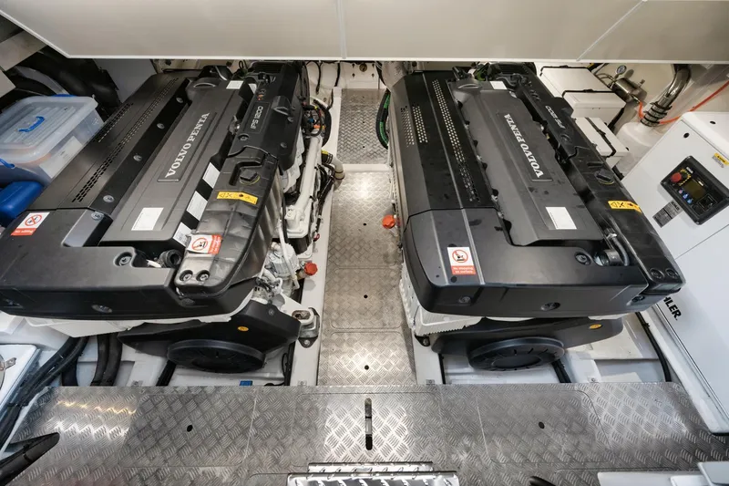 Slide: The Image of Engine room of 2022 Pearl 62 yacht with dual Volvo Penta engines. - 31