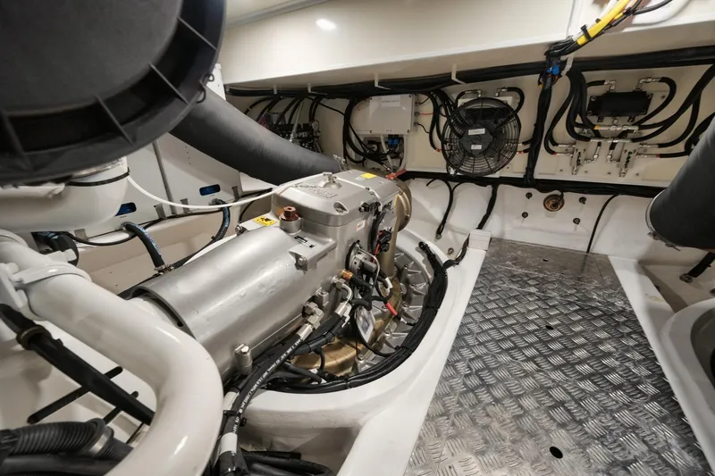 Slide: The Image of Engine room of 2022 Pearl 62 yacht, featuring advanced mechanical systems and wiring. - 32