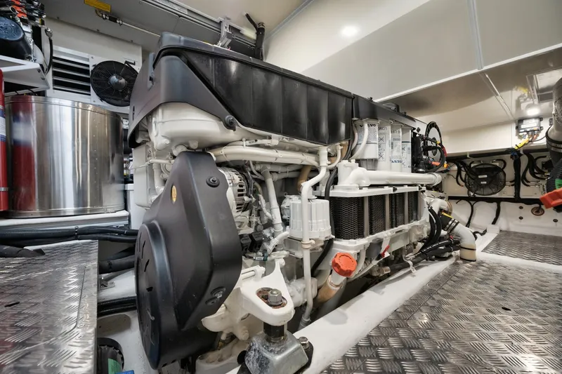 Slide: The Image of Engine room of 2022 Pearl 62 yacht, showcasing modern machinery and components. - 34