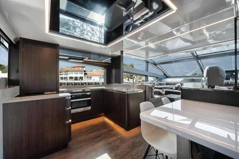 Slide: The Image of Luxurious interior of 2022 Pearl 62 yacht with modern kitchen and panoramic windows. - 4