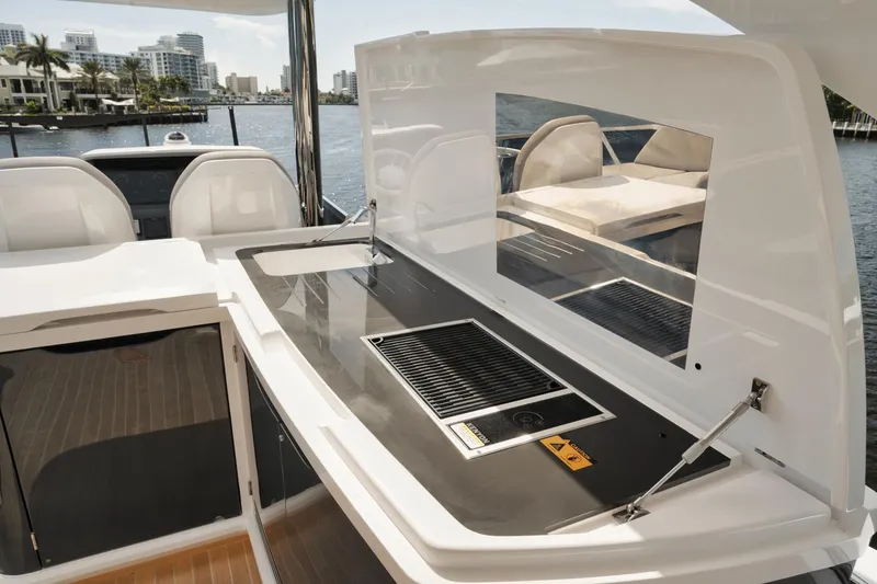 Slide: The Image of Outdoor kitchen on 2022 Pearl 62 yacht with grill and seating area. - 40