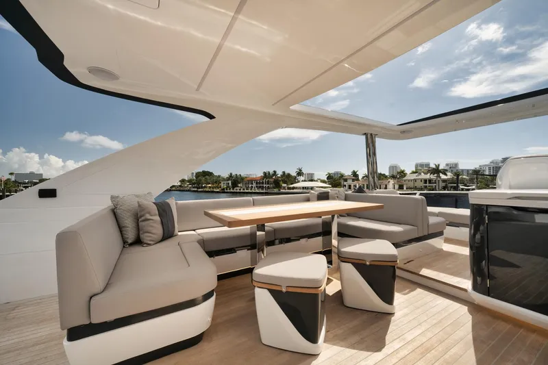 Slide: The Image of Luxurious 2022 Pearl 62 yacht interior with elegant seating and dining area. - 41