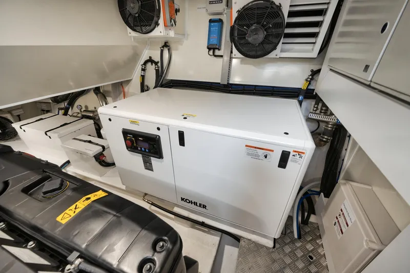 Slide: The Image of Engine room of 2022 Pearl 62 yacht with Kohler generator and ventilation system. - 43
