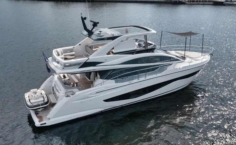 Slide: The Image of Luxurious 2022 Pearl 62 yacht on calm water, showcasing sleek design and spacious decks. - 45
