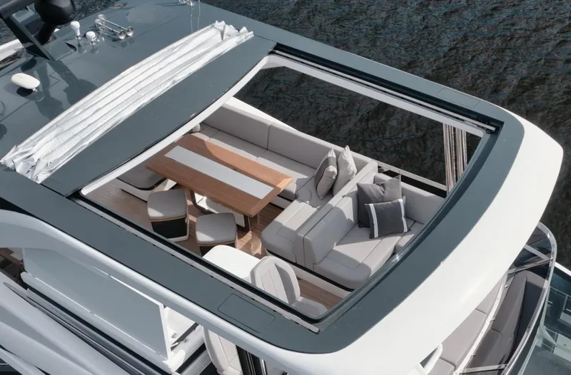 Slide: The Image of Luxurious seating area on 2022 Pearl 62 yacht with open roof and elegant design. - 49