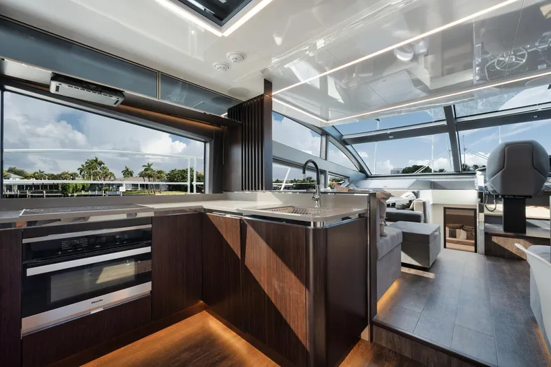 Slide: The Image of Luxurious interior of 2022 Pearl 62 yacht with modern kitchen and panoramic windows. - 6