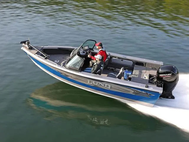 Slide: The Image of 2024 Lund 1875 Tyee Sport boat cruising on water with Mercury engine. - 1