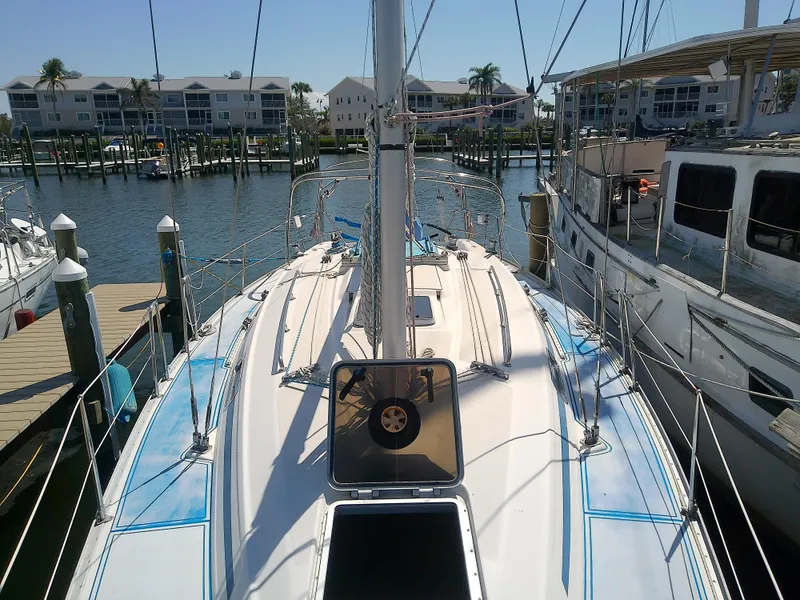 Slide: The Image of Bavaria 37 Cruiser 2001 sailboat docked at marina, sunny day, waterfront view. - 11