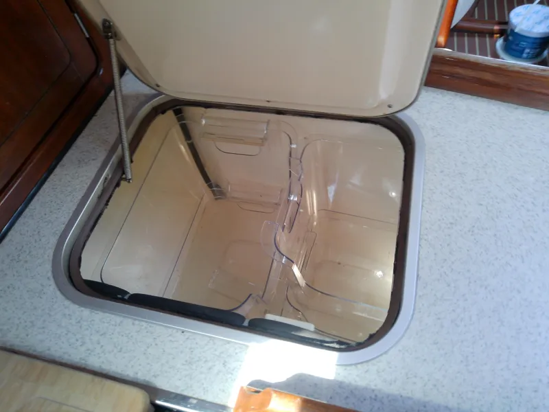 Slide: The Image of Open storage compartment on 2001 Bavaria 37 Cruiser yacht interior. - 28