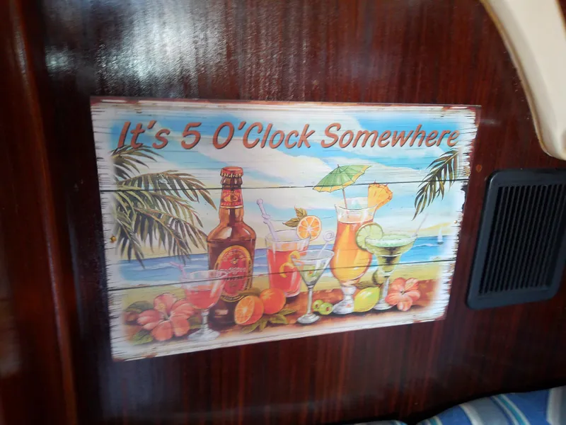 Slide: The Image of Tropical drinks sign on Bavaria 37 Cruiser, 2001, with "It's 5 O'Clock Somewhere" text. - 33
