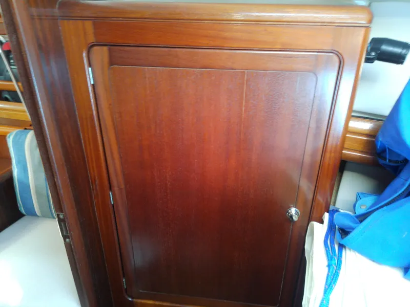 Slide: The Image of Wooden cabinet door inside a 2001 Bavaria 37 Cruiser yacht interior. - 42