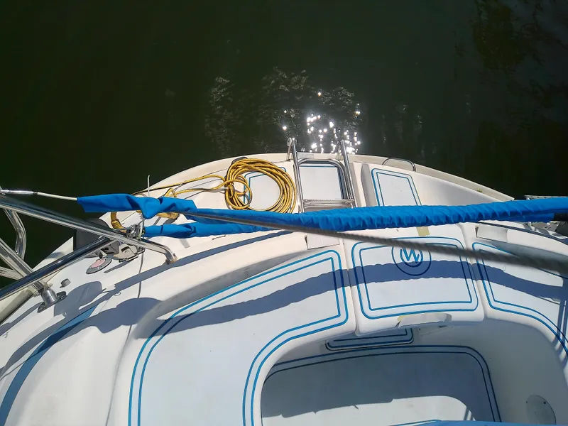 Slide: The Image of Bavaria 37 Cruiser 2001 yacht deck with blue accents and coiled rope. - 5