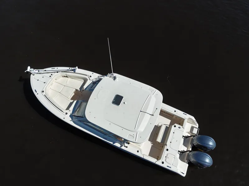 Slide: The Image of 2022 Grady-White Freedom 307 boat on dark water, aerial view. - 40