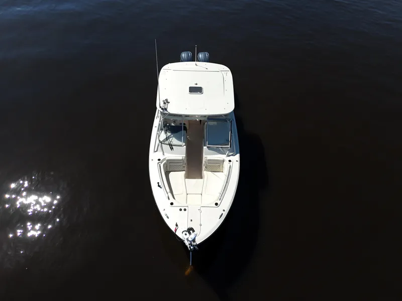 Slide: The Image of 2022 Grady-White Freedom 307 boat on calm water, aerial view. - 43