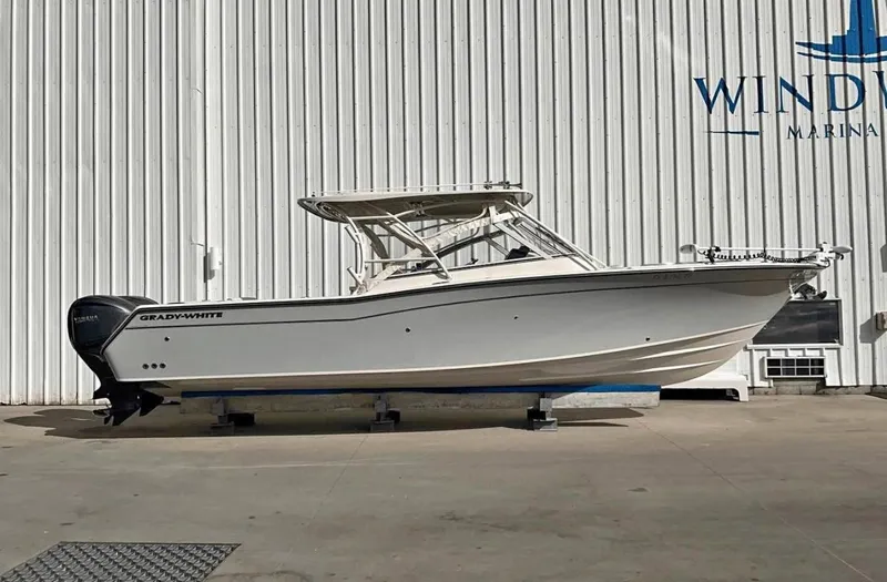Slide: The Image of 2022 Grady-White Freedom 307 boat displayed at a marina. - 47