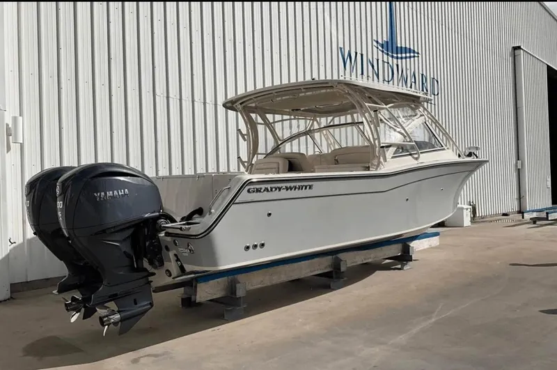 Slide: The Image of 2022 Grady-White Freedom 307 boat with dual Yamaha engines, docked at Windward facility. - 48