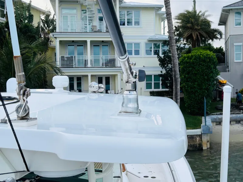Slide: The Image of 2016 Boston Whaler 370 Outrage boat docked near waterfront homes. - 10