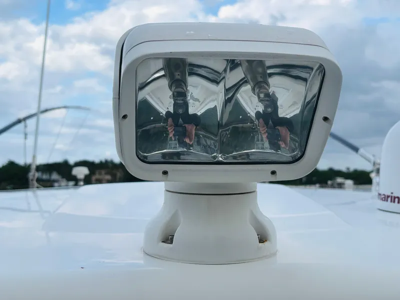 Slide: The Image of Close-up of a 2016 Boston Whaler 370 Outrage spotlight against a cloudy sky. - 12