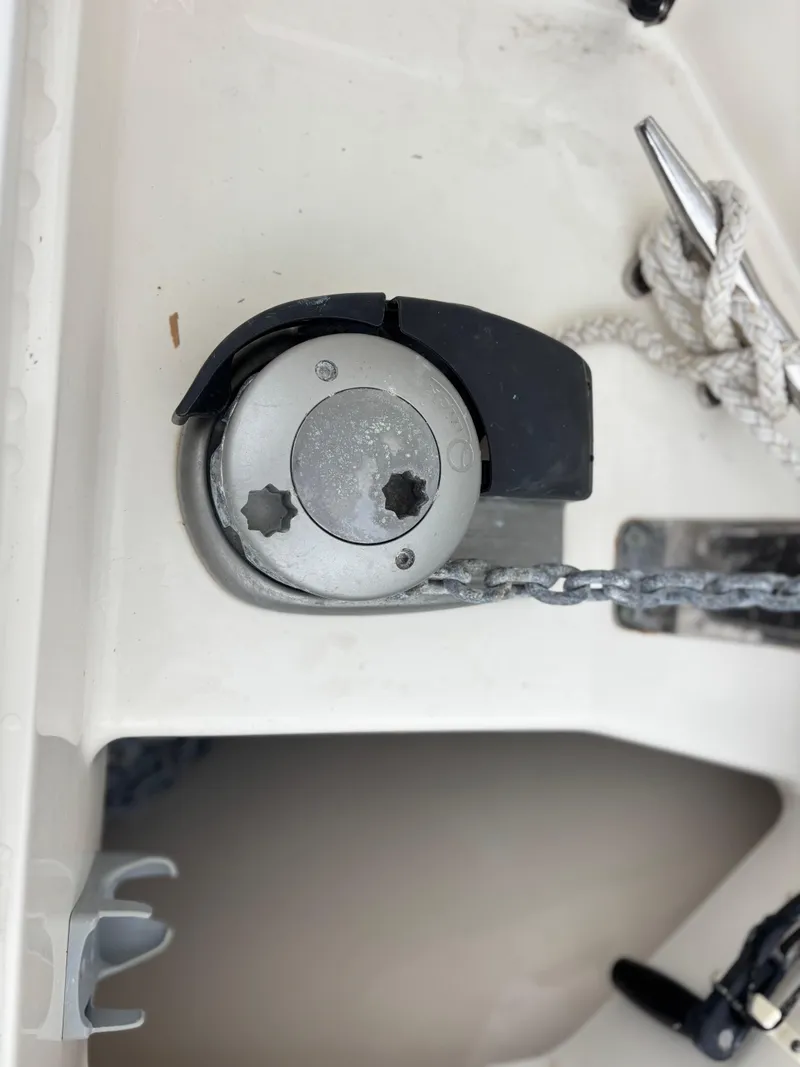 Slide: The Image of 2016 Boston Whaler 370 Outrage boat anchor mechanism with chain and cleat. - 15