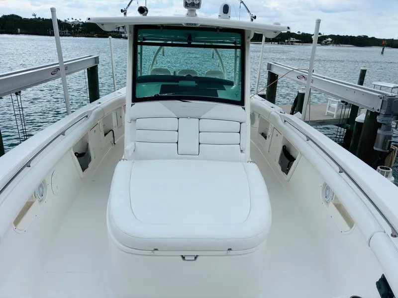Slide: The Image of 2016 Boston Whaler 370 Outrage boat interior, featuring spacious seating and sleek design. - 19
