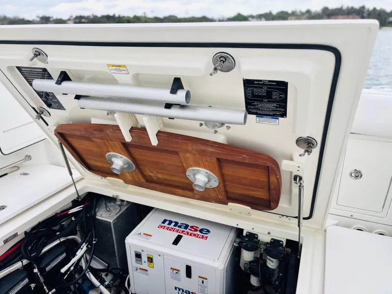 Slide: The Image of Boston Whaler 370 Outrage 2016 boat storage compartment with equipment and accessories. - 22
