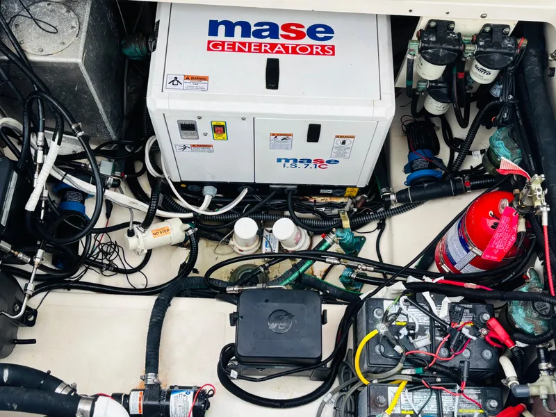 Slide: The Image of Engine compartment of 2016 Boston Whaler 370 Outrage with Mase generator and wiring. - 24