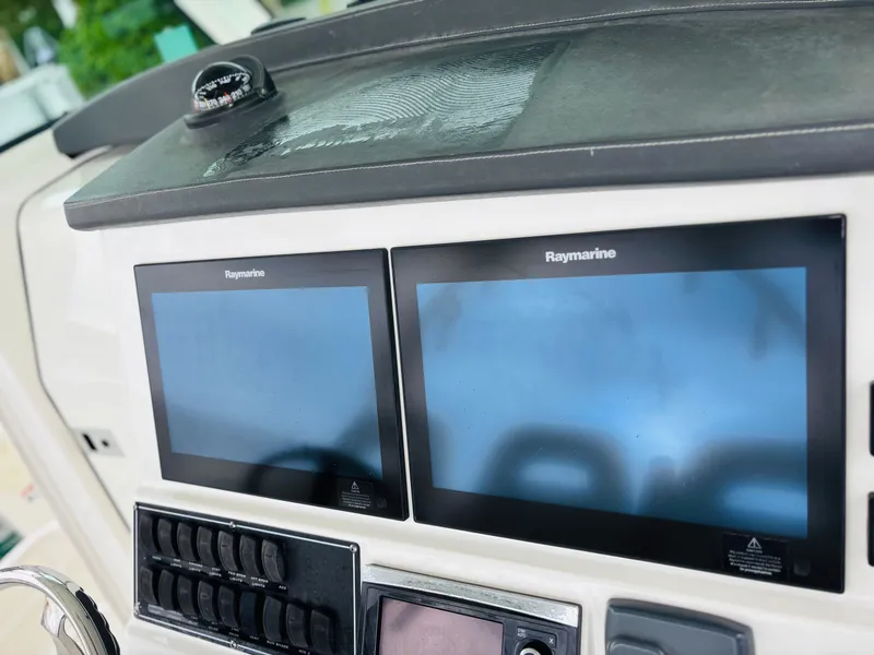 Slide: The Image of Control panel of 2016 Boston Whaler 370 Outrage with Raymarine displays. - 30