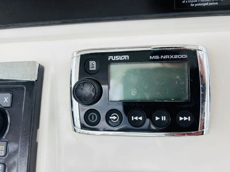 Slide: The Image of Fusion MS-NRX200i marine stereo on 2016 Boston Whaler 370 Outrage dashboard. - 33