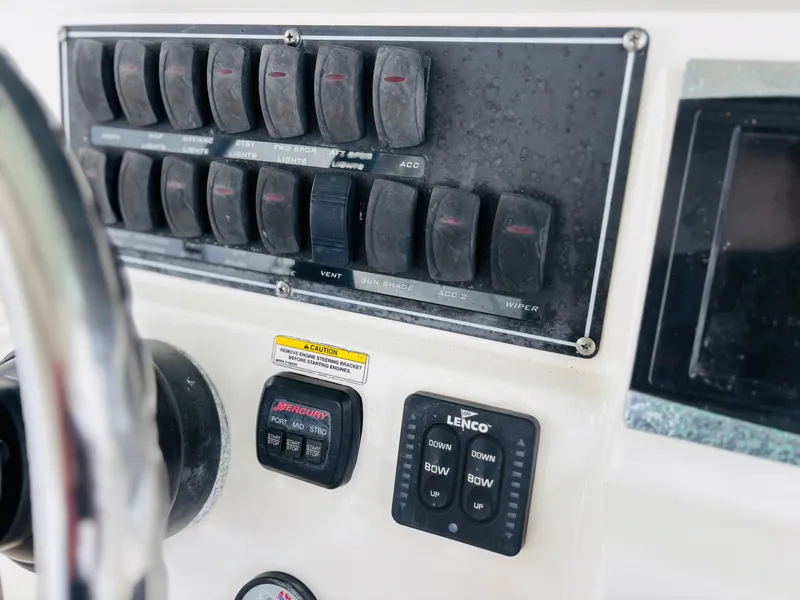 Slide: The Image of Control panel of a 2016 Boston Whaler 370 Outrage boat. - 35