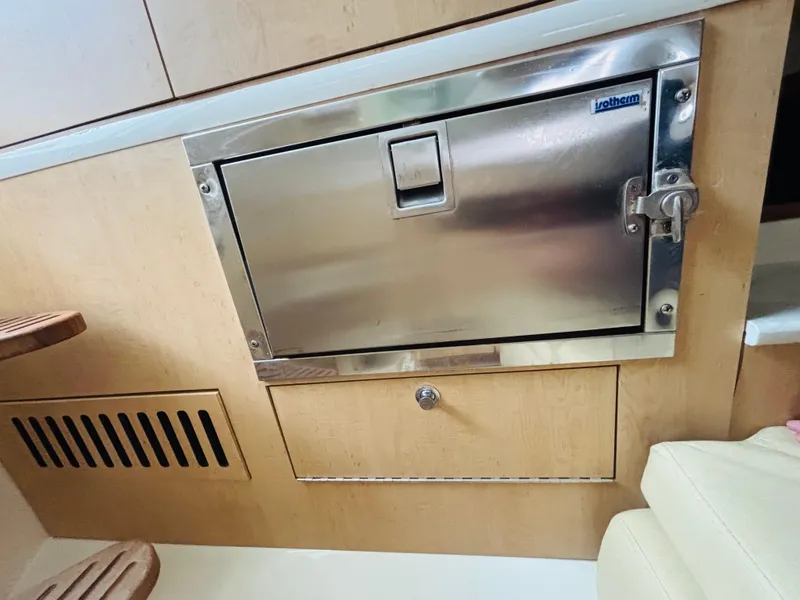Slide: The Image of Interior of a 2016 Boston Whaler 370 Outrage featuring a stainless steel cabinet. - 49