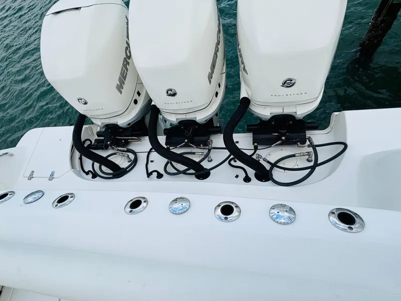 Slide: The Image of 2016 Boston Whaler 370 Outrage with triple Mercury outboard engines on the water. - 6