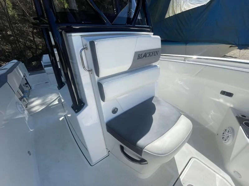 Slide: The Image of 2019 Blackfin 212 CC boat interior with cushioned seating and sleek design. - 9