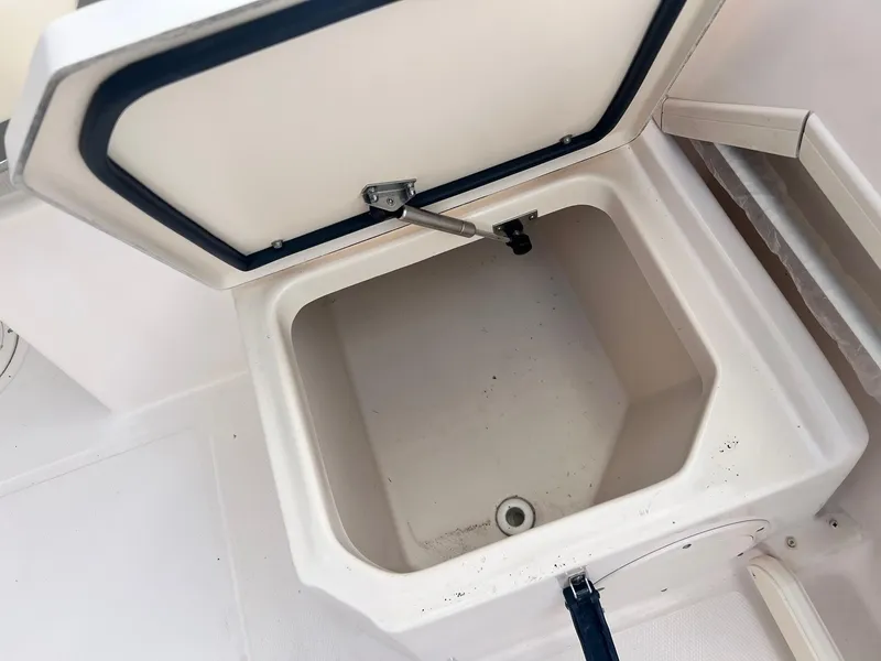 Slide: The Image of Open storage compartment on 2007 Grady-White Adventure 208 boat. - 15